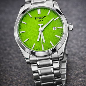 tissot prx watch with a green dial