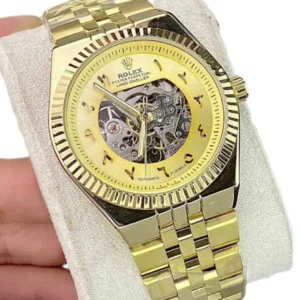 rolex gold tone men's automatic skeleton watch with a fluted bezel and arabic numerals.